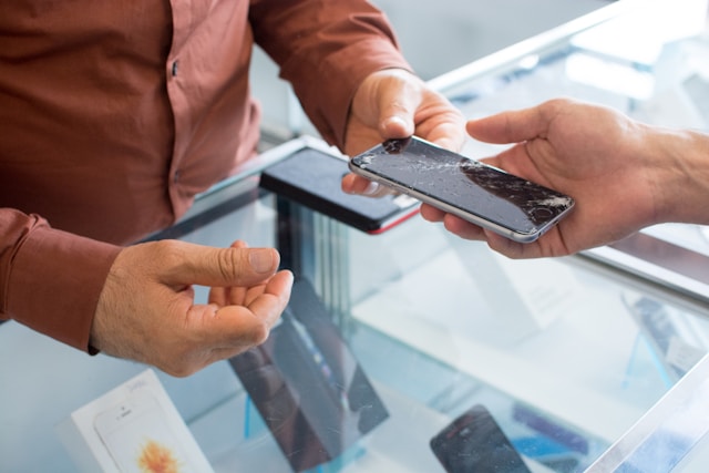 close-up to a phone with broken screen