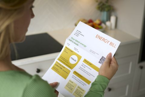 Woman reading her energy bill