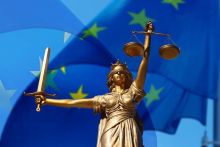 Lady Justice in front of EU flag
