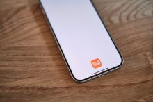 Mobile phone with Temu App on screen