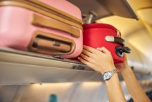 Putting hang luggages in plane