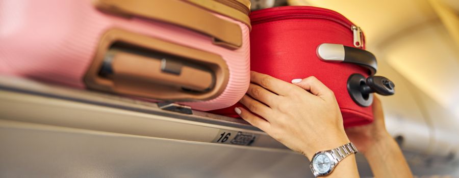 Putting hang luggages in plane
